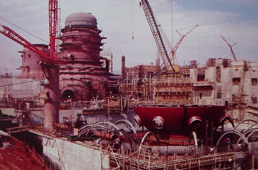 Browns Ferry Nuclear Plant under construction, showing the containment vessels for all three units (Unit 1 furthest from camera.)  From 1976 TVA brochure.