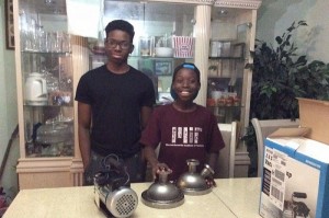 Steven (L) and Anthony (R) Udotong.  Steven is well on the way to constructing a nuclear fusor, some of whose components are seen here.