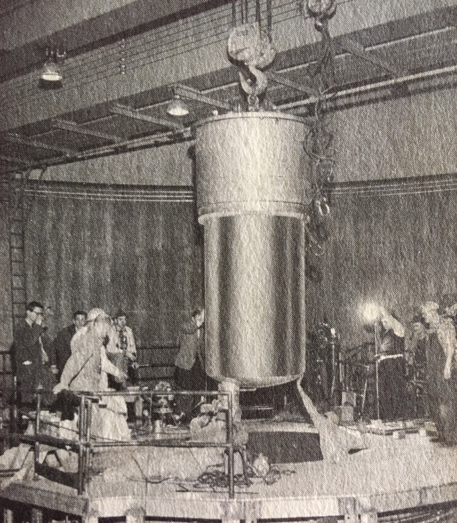 "Core tank of ACF-built research reactor at MIT is lowered into place as unit nears completion."  ACF Horizons, August, 1958; in Will Davis collection.